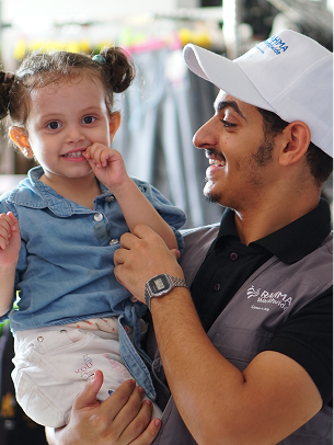 Volunteer with child